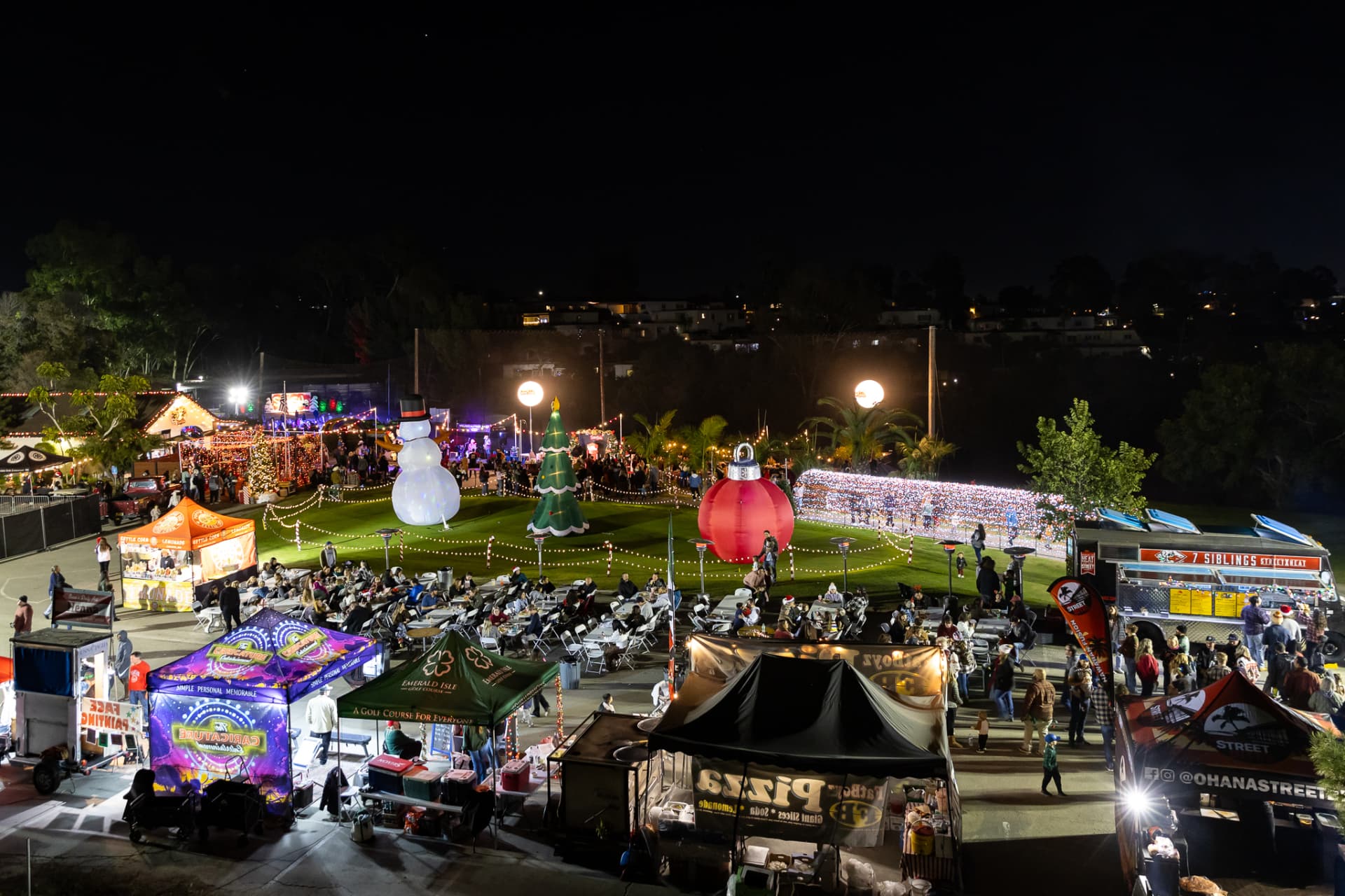 Aerial view of the SnowSide festival grounds lit up at night