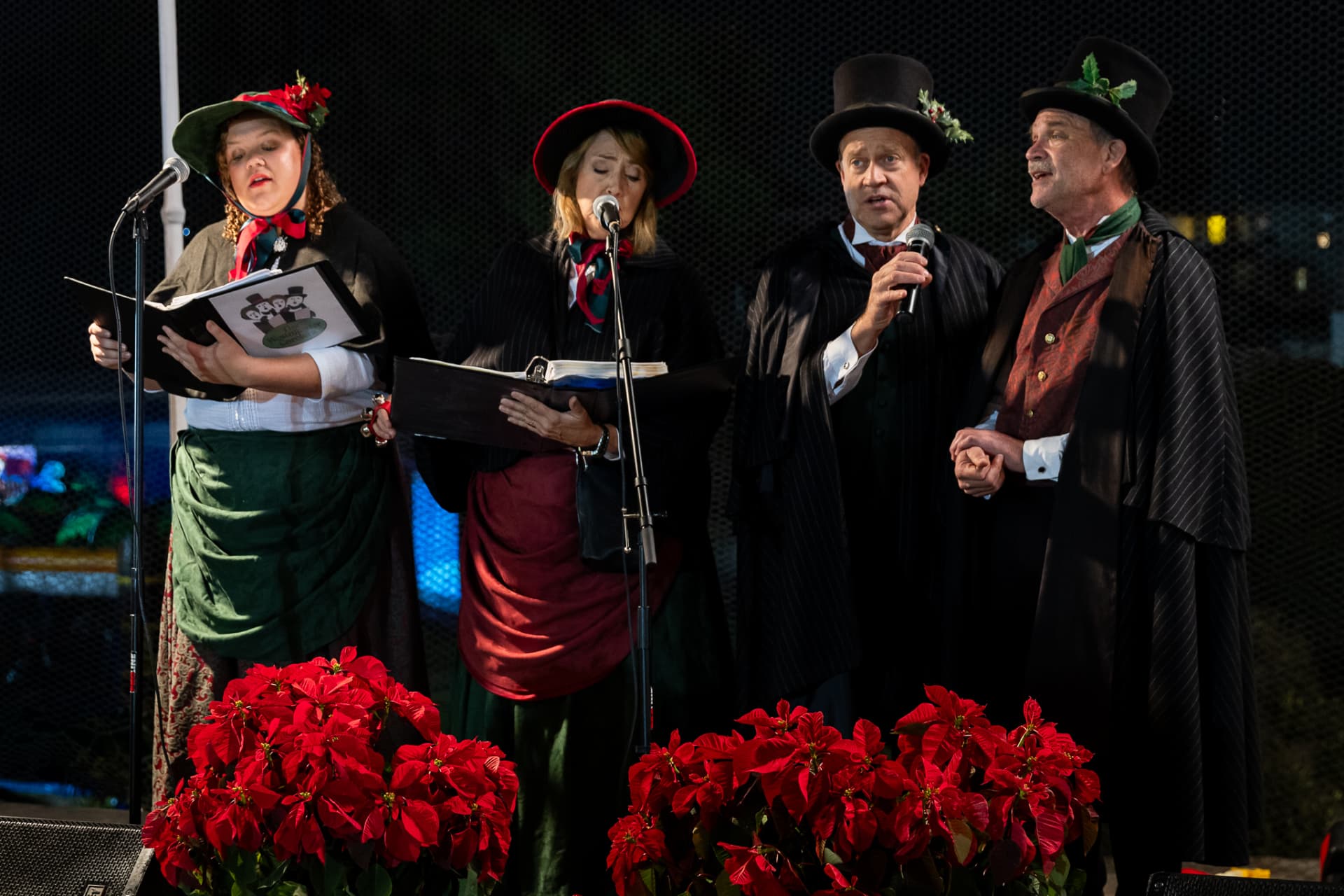 Victorian carolers performing live on the SnowSide stage